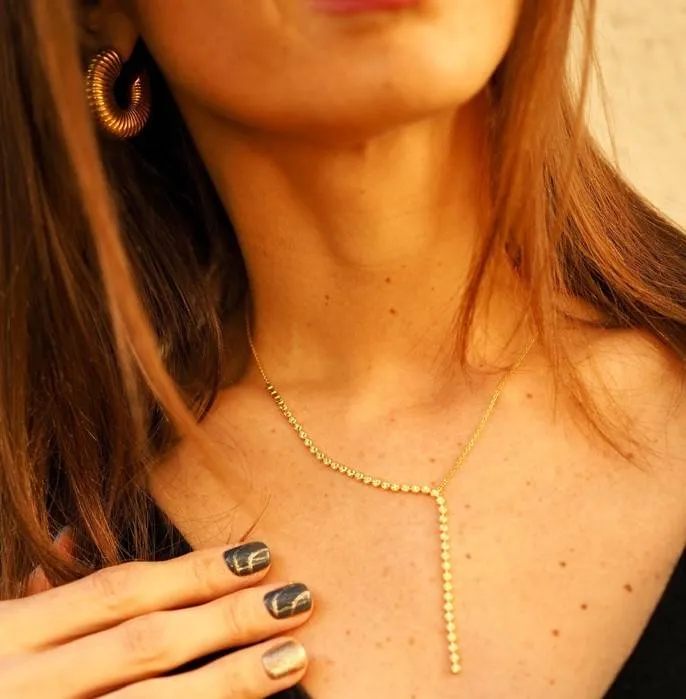 Collar tira cruzada oro